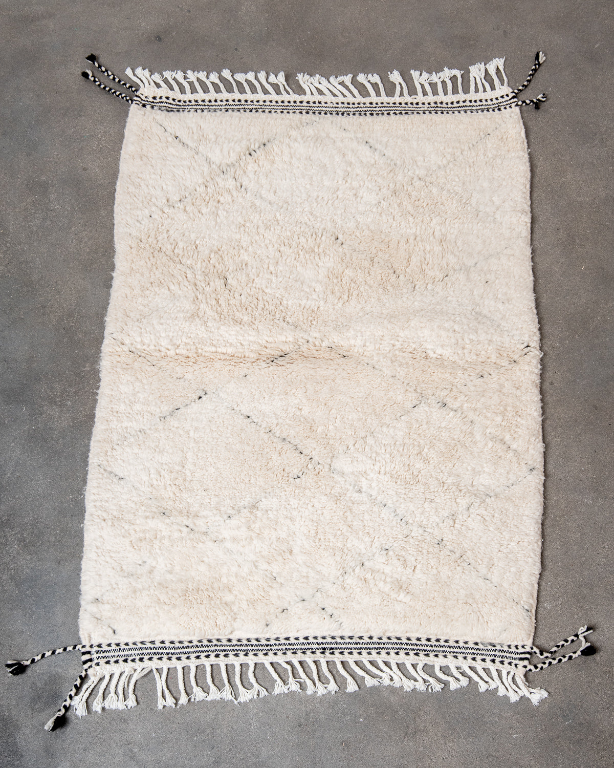 Modern, designer, handcrafted Berber rug from Morocco. Beniourain carpet with minimalist design, natural wool pile and a fluffy texture.